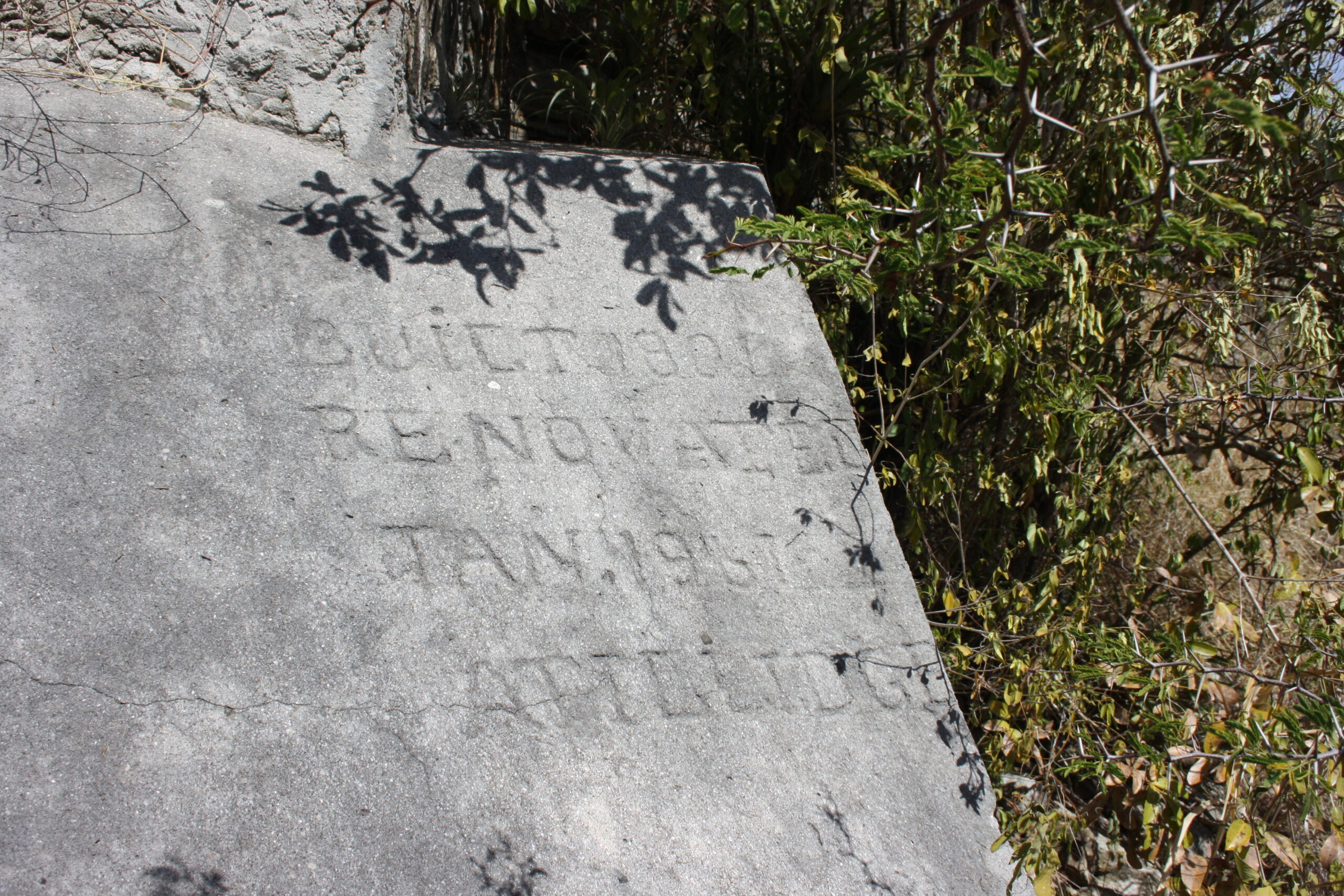 Historic rock text in Fort Willem / Fort William ruins near Little Bay