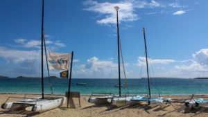 Orient Beach with sailboats on the shore during a warm day on St Maarten / St Martin