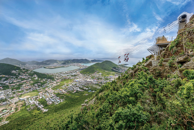 A view of people on the Flying Dutchman at Rainforest Adventures St Maarten, with a view over the Dutch Caribbean island