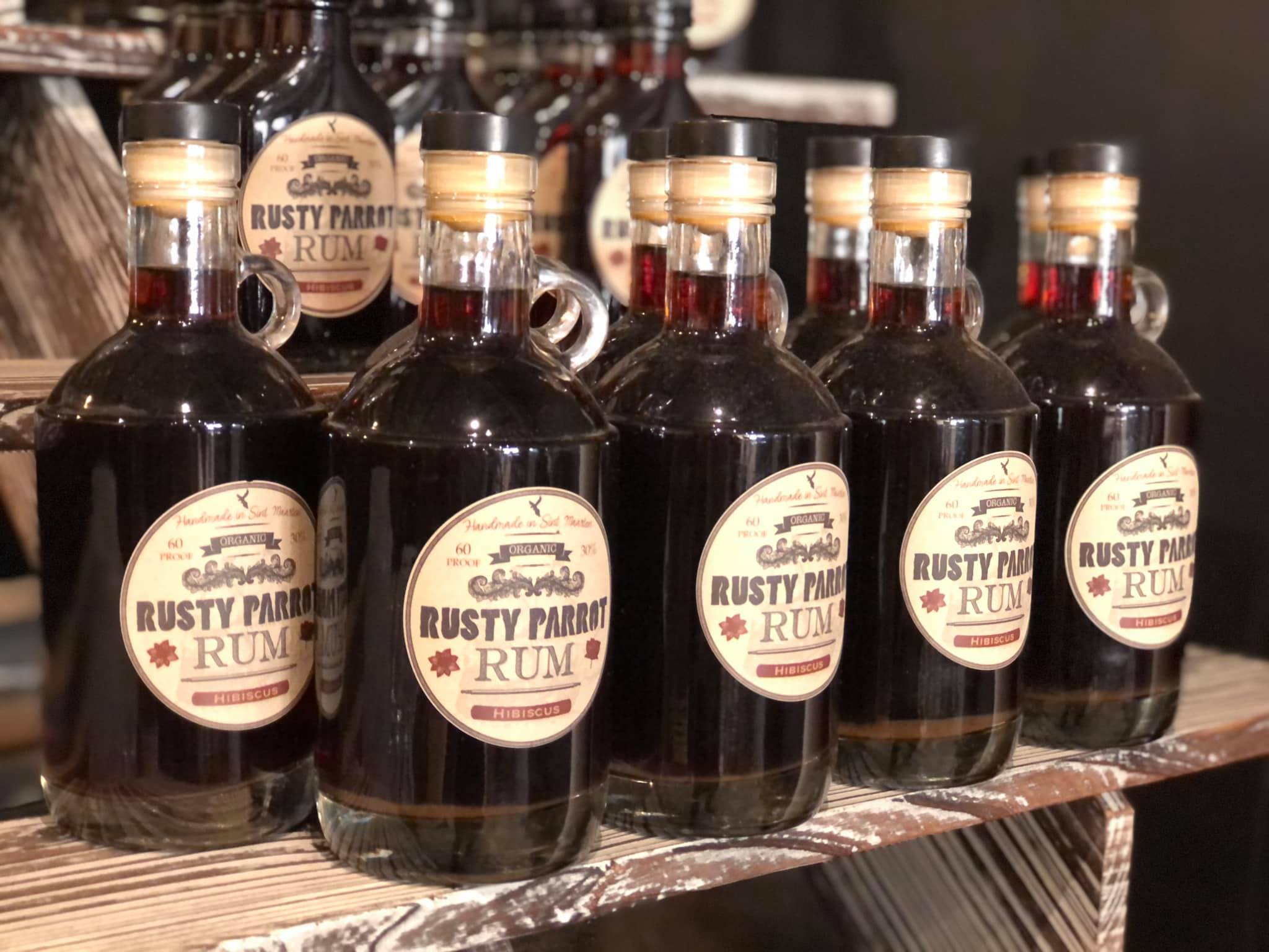 Multiple rum bottles of the Rusty Parrot in St Maarten