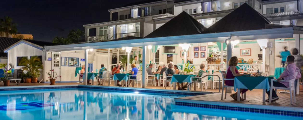 Hideaway Restaurant pool side view with seated guests