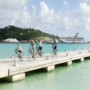 Some bikers cycling on a pier