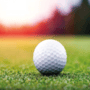 Golf ball at the Golf Track with a sunset background