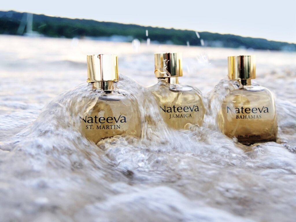 Nateeva perfums on a beach with waves